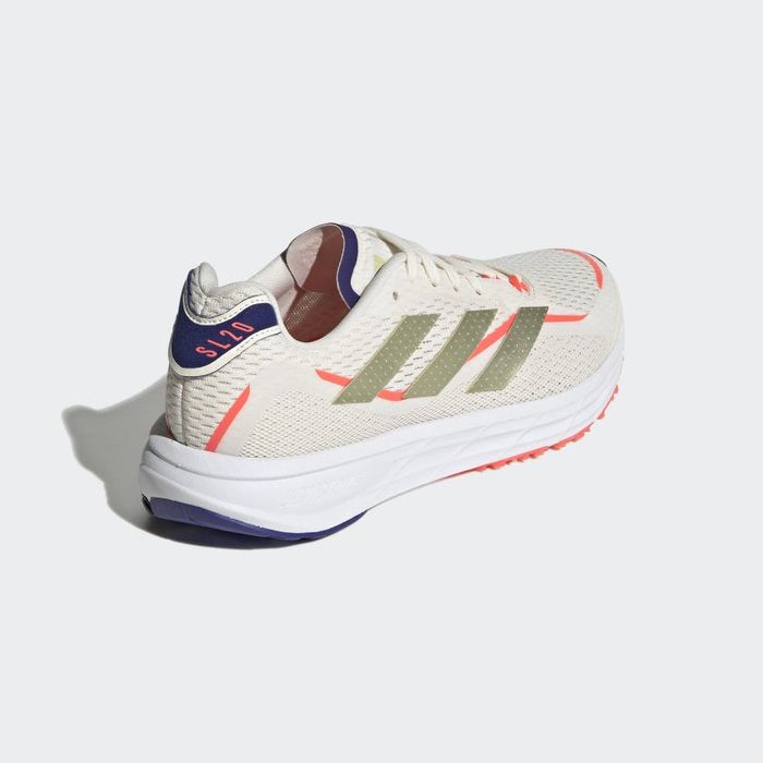 back view of the sneakers in a blend of beige, coral, navy, white, and gold