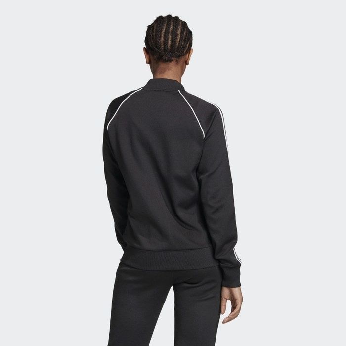 back view of the model rocking the jacket in black
