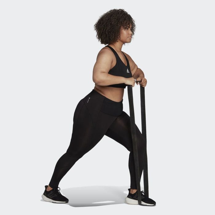 side view of a model wearing the training tights