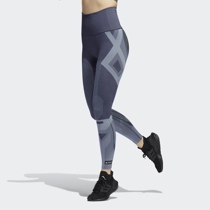Side view of the model wearing the graphic grey/blue tights.