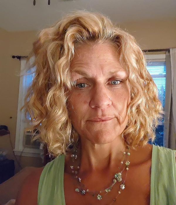 Another reviewer highlights their short blonde curls in the feedback.