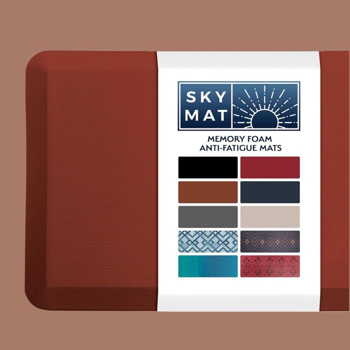 A red memory foam anti-fatigue mat set against a beige background