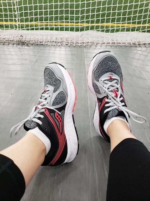 A reviewer wearing Saucony Cohesion 10s