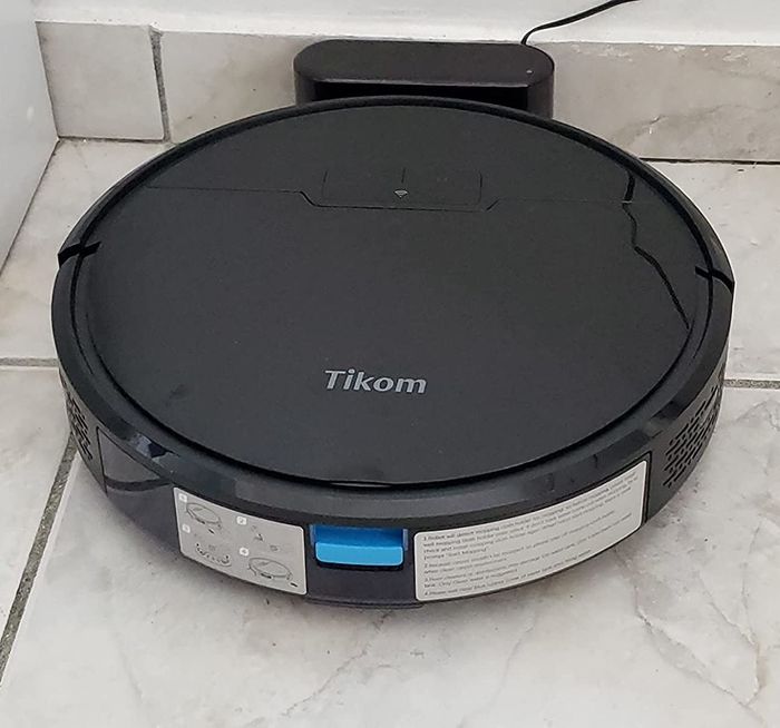 A reviewer photo of the vacuum resting on its charging dock