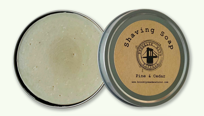 Pine and cedar shaving soap in a round tin container