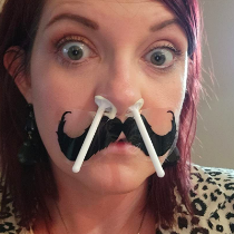 Reviewer with the wax sticks inserted into their nostrils