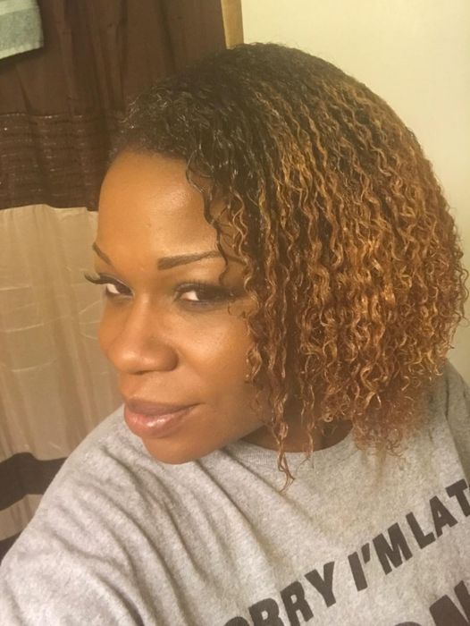 A reviewer showcasing beautifully detangled type 4 hair.