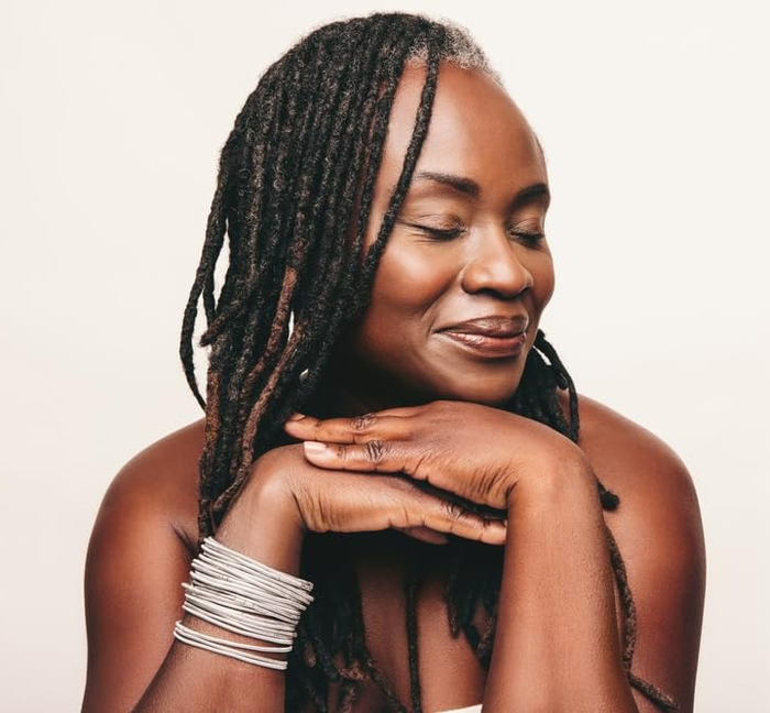 A model showcasing well-maintained and neatly styled locs.