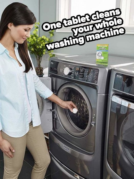 Product image showing a model placing Affresh washing machine tablets into their washing machine
