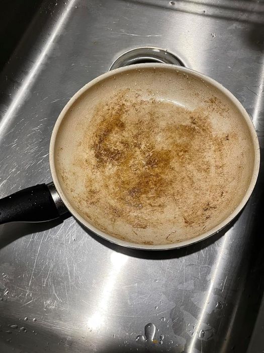 Before image of a heavily stained beige pot