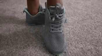 A gif of a reviewer demonstrating the front and sides of Lamincoa running shoes
