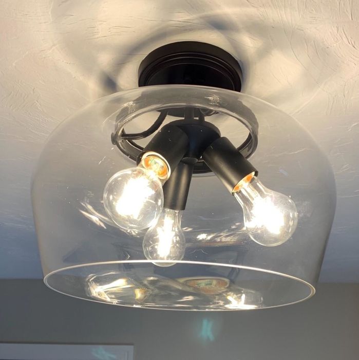 A reviewer shows a photo of the same lampshade, now clear and clean.