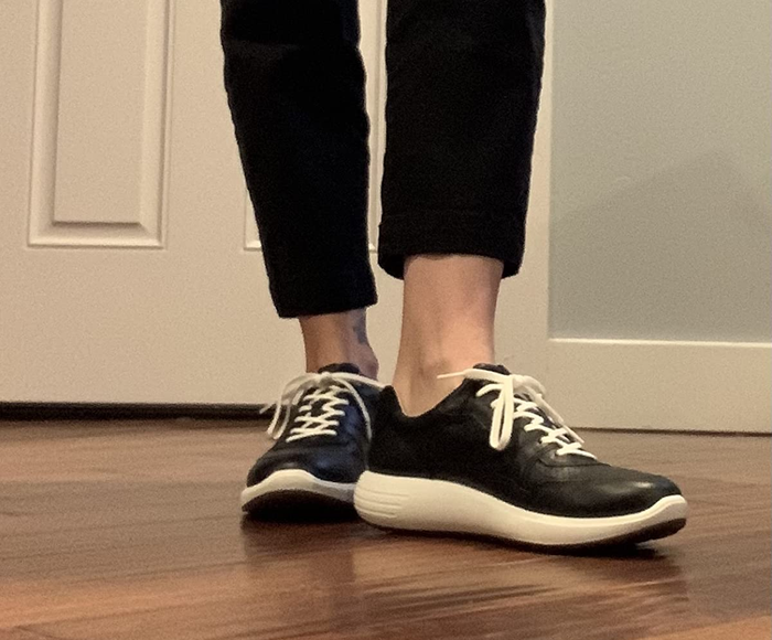 A reviewer sporting the Ecco Soft 7 Runner Sneakers
