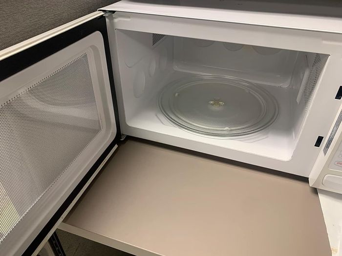 after image of the same microwave now completely clean and stainless