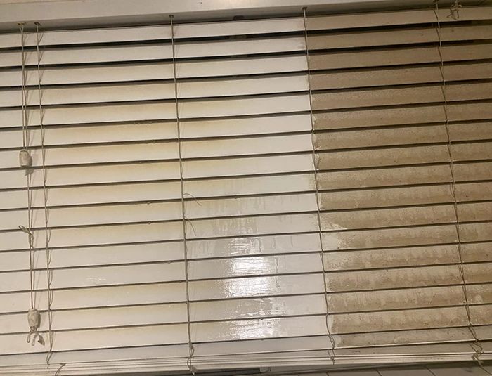 Reviewer’s image of blinds, half clean and half covered in dust