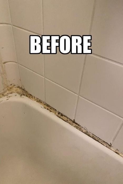 A reviewer’s photo showing a bathtub with dirty caulking