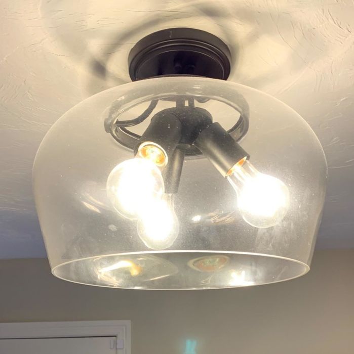 A reviewer has shared a photo of a foggy glass lampshade.
