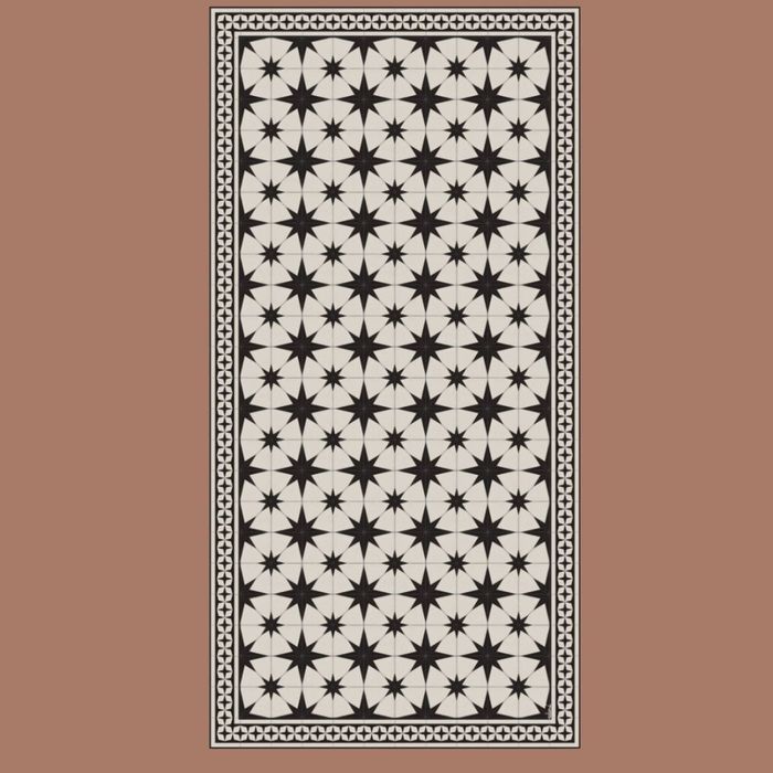 A mat featuring a black and white starburst pattern set against a beige background