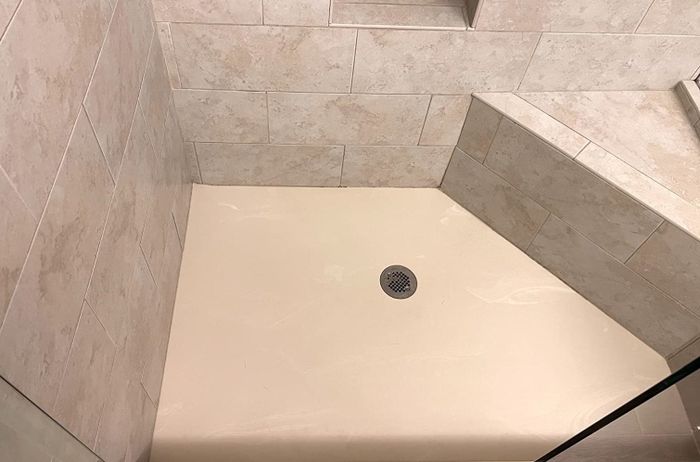 After image showing the same shower completely clean and spotless
