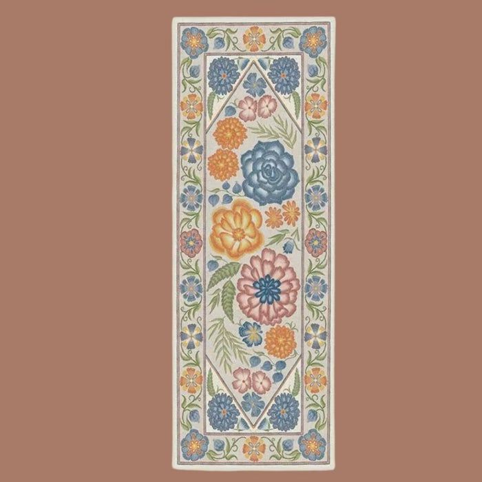 A beige rug adorned with a floral pattern