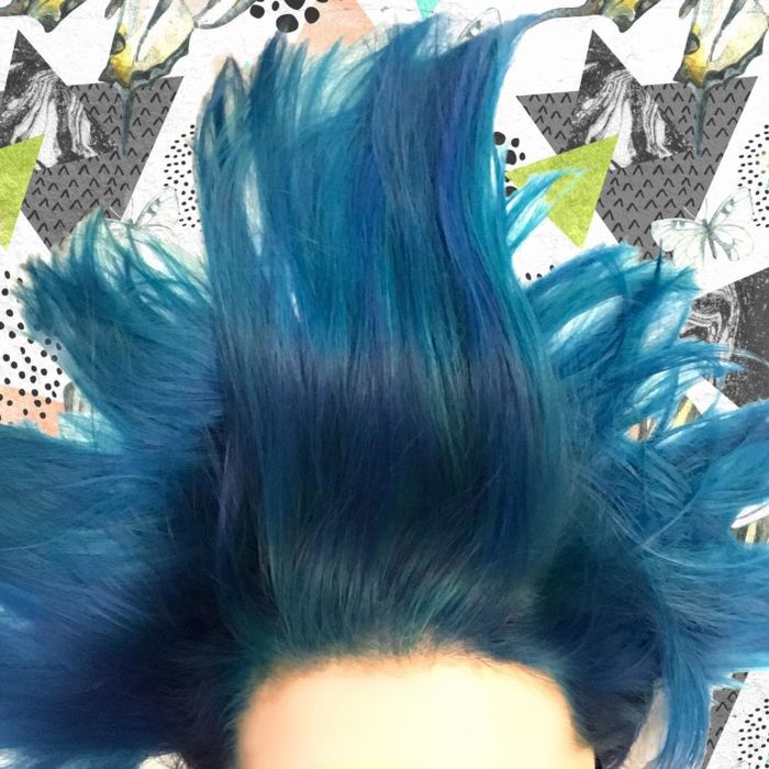 a reviewer showcasing striking blue hair