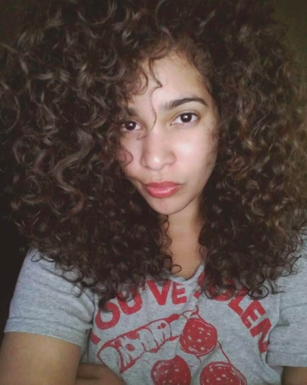 a reviewer showcasing perfectly defined curls
