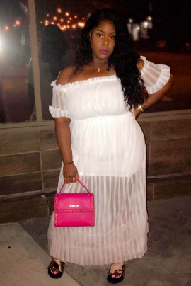reviewer wearing the dress in a crisp white shade