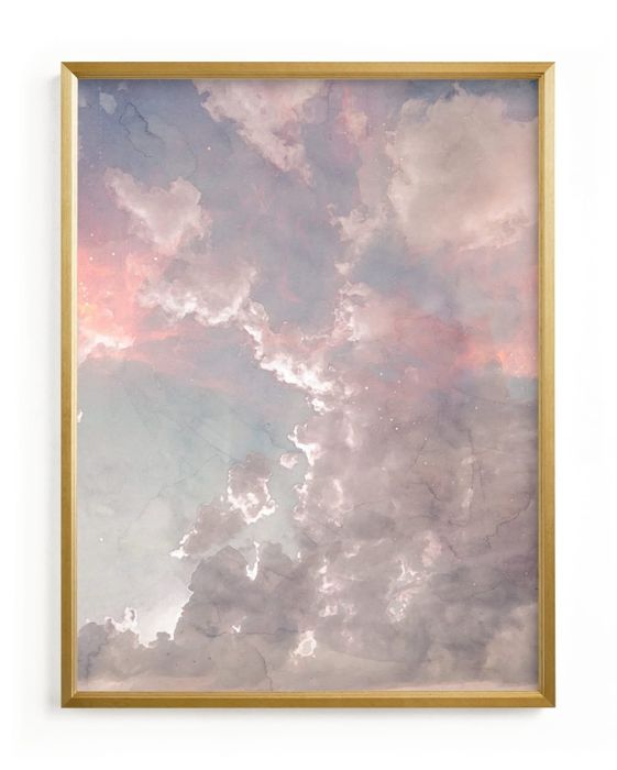 A framed abstract artwork depicting a cloudy sky, perfect for home decor