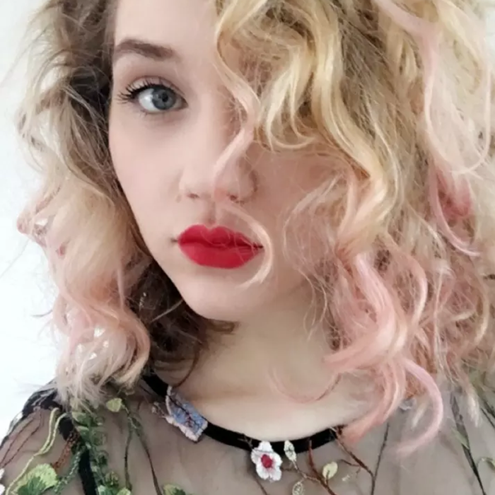 a Mytour editor with stylish pink-tipped hair