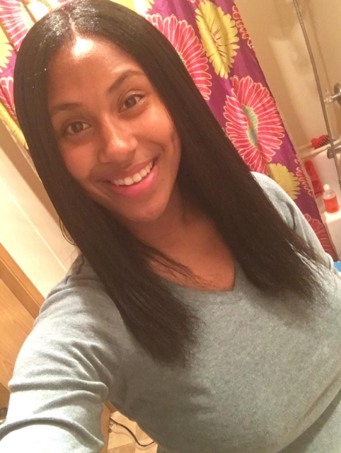 The same reviewer showing their hair fully straightened