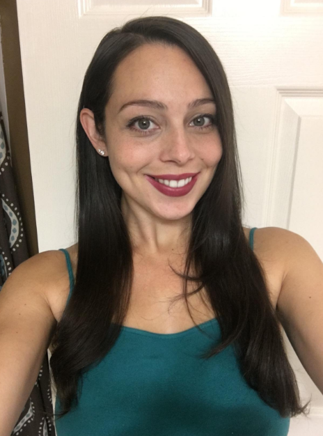 the same reviewer displaying pin-straight hair after using the product