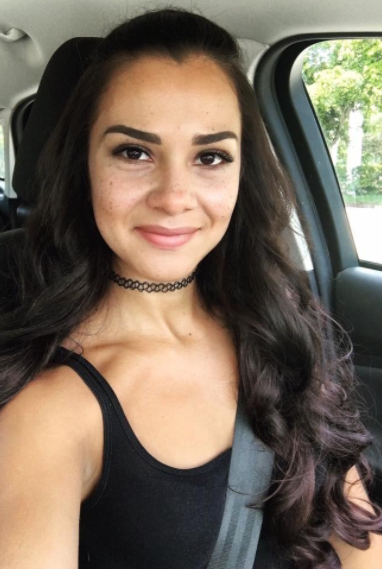 The same reviewer showcasing the extensions, which seamlessly blend with her natural hair