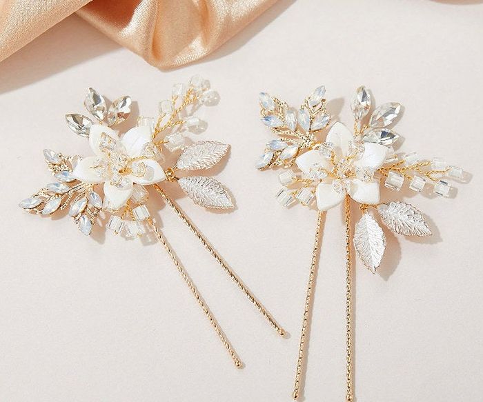 The two white and gold pins