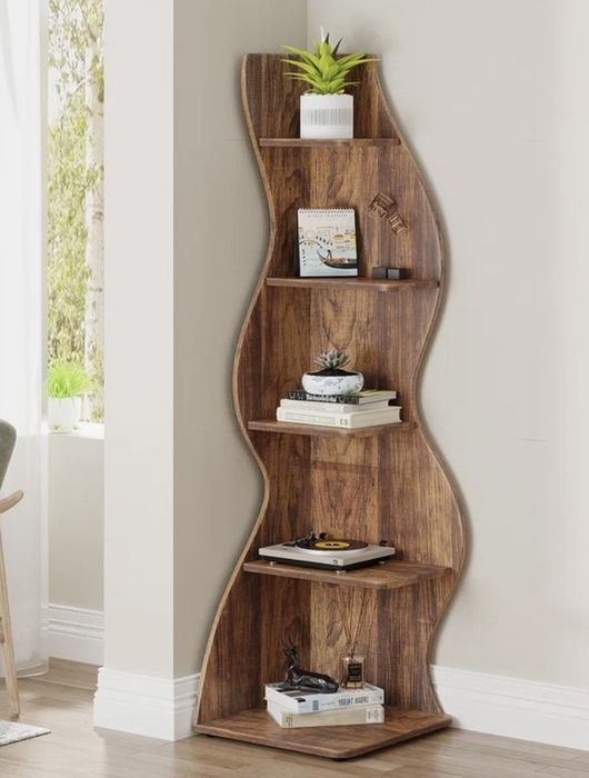 A bookshelf filled with books, decorative plants, and small ornaments, positioned against a wall