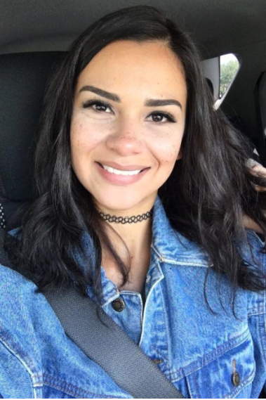 A reviewer with shoulder-length hair before applying the extensions