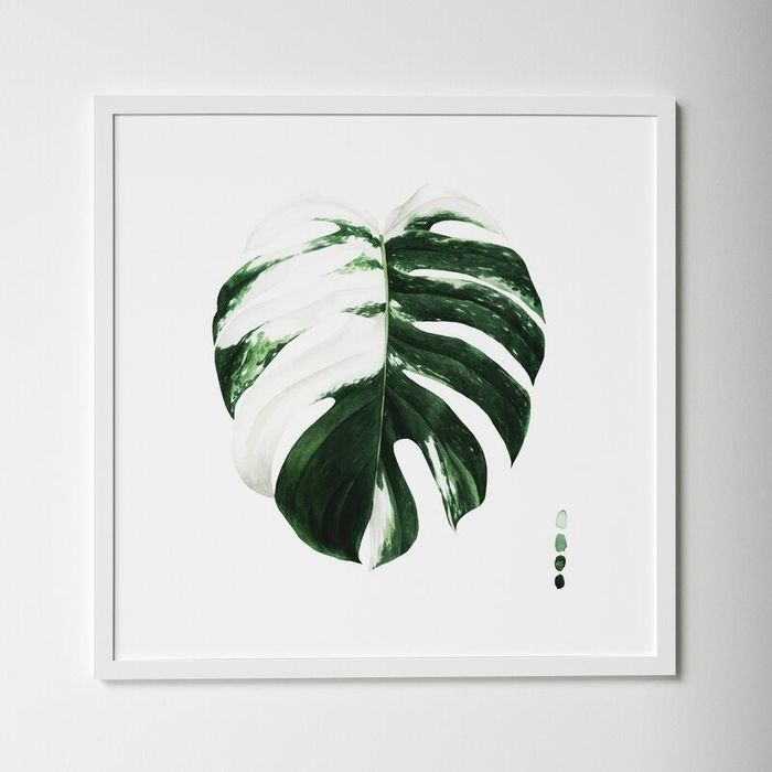Framed artwork showcasing a painted monstera leaf, perfect for home decor