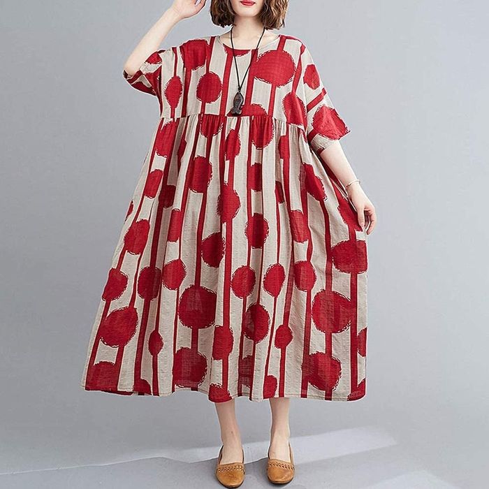 a red polka dot and striped dress with sleeves, ending just above the ankle
