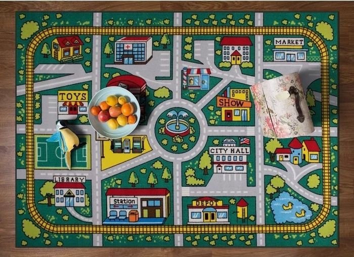 The city map rug spread out on the floor, ready for playtime adventures.