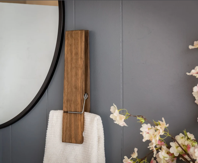 The oversized clothespin holding a towel