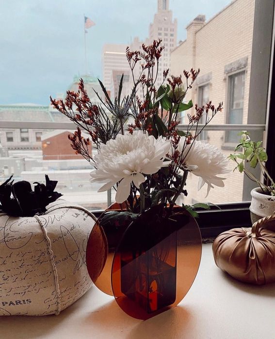 A reviewer's photo showcasing a beautiful floral arrangement inside the vase