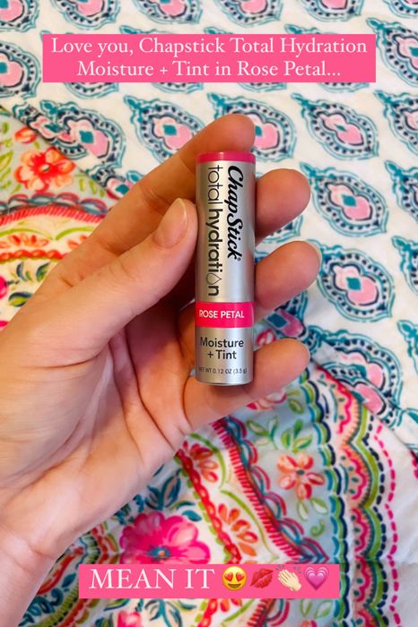 writer holding ChapStick Total Hydration Moisture + Tint in Rose Petal