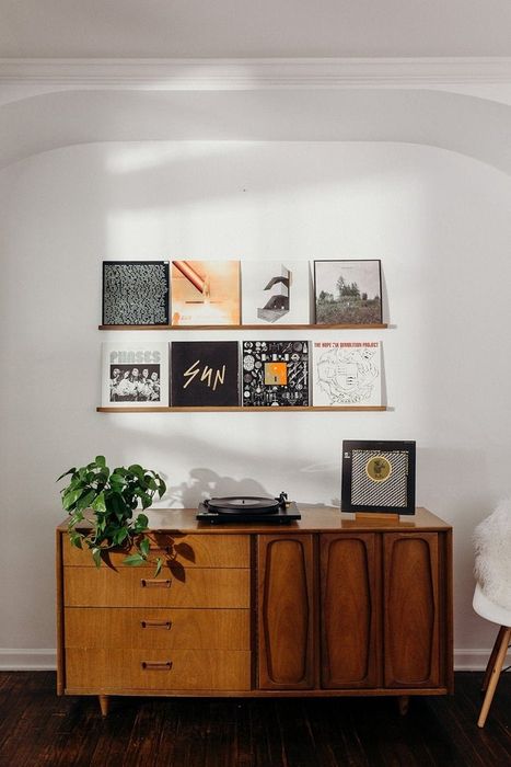 A cabinet featuring a record player on top