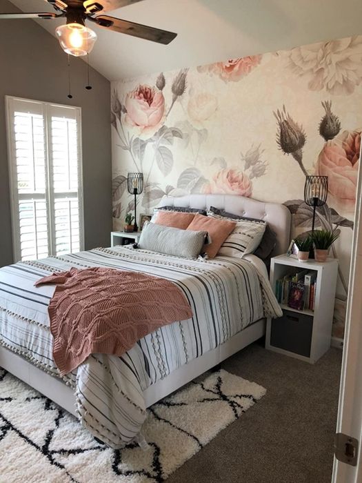 A reviewer's bedroom showcasing the mural as a stunning backdrop behind their bed