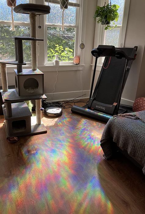 A reviewer's room with the floor illuminated by rainbow reflections