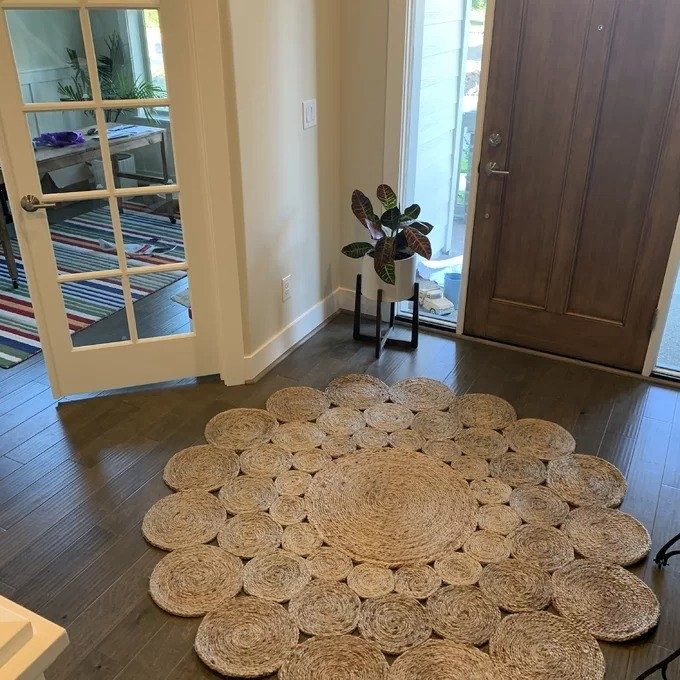 A customer's photo showcasing the rug placed in an entryway.