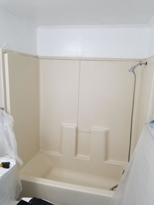 Before: A reviewer's almond-colored tub and surrounding tiles.