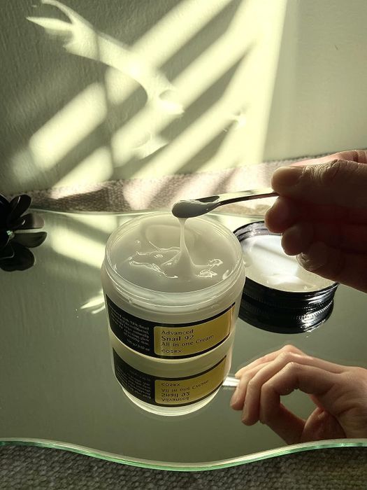 A jar filled with snail mucin moisturizer