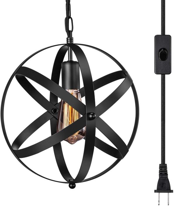 A light bulb hangs from a cord, surrounded by a fixture of four rings that form a sphere-like shape.