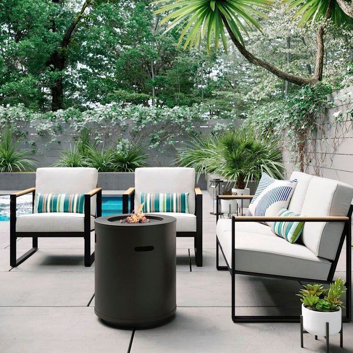 A patio setup featuring a central column surrounded by four cozy seating options.