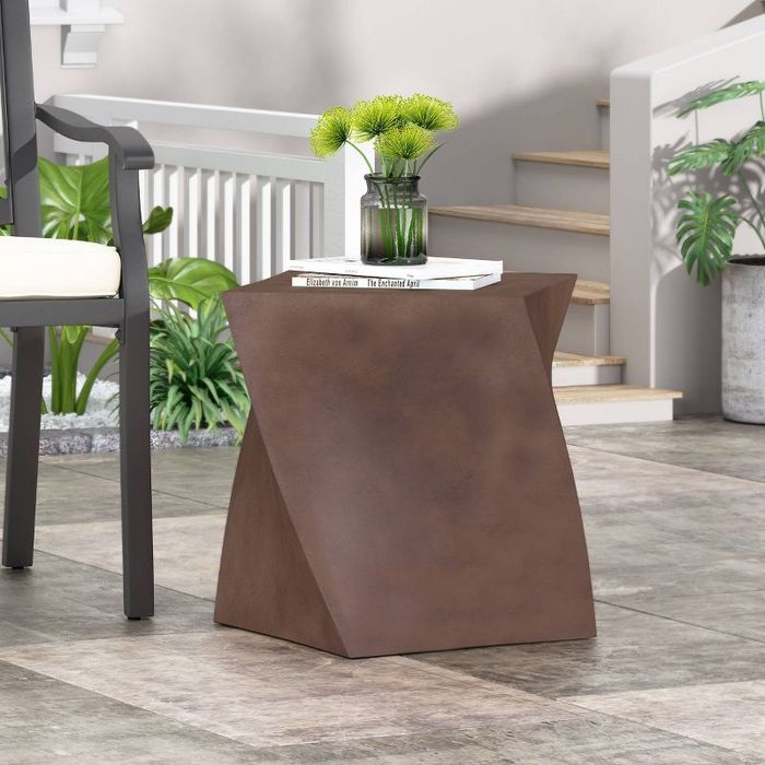 The table placed beside a patio chair.